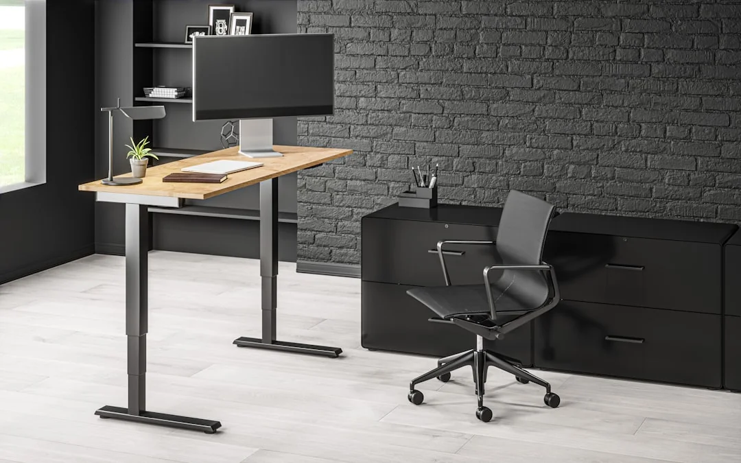 Spacious and contemporary office interior with glass partitions, stylish furniture, and vibrant wall art.